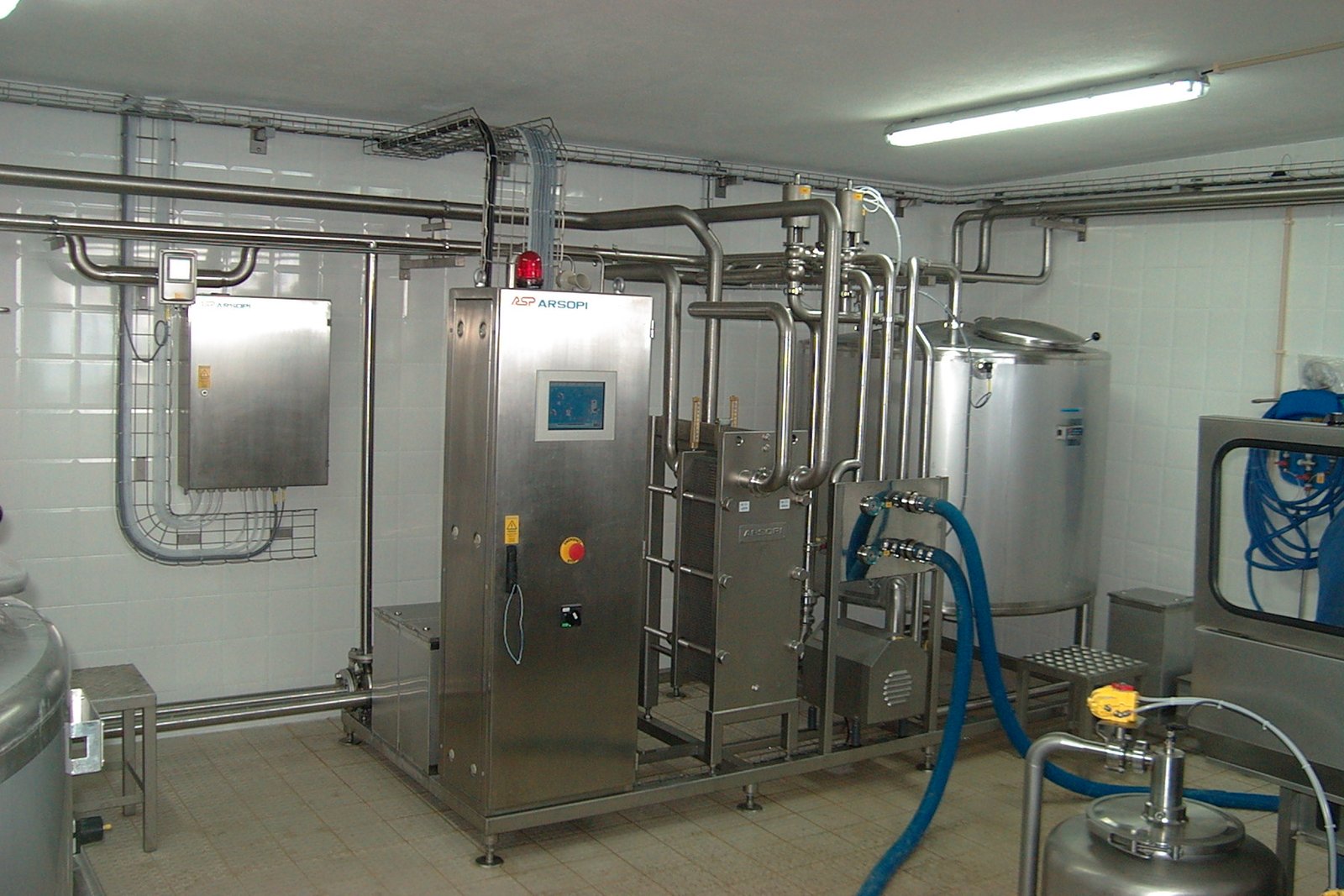 Milk reception & storage: can/tanker intake, plate chilling and insulated raw milk silos — SS Engineers & Consultants
